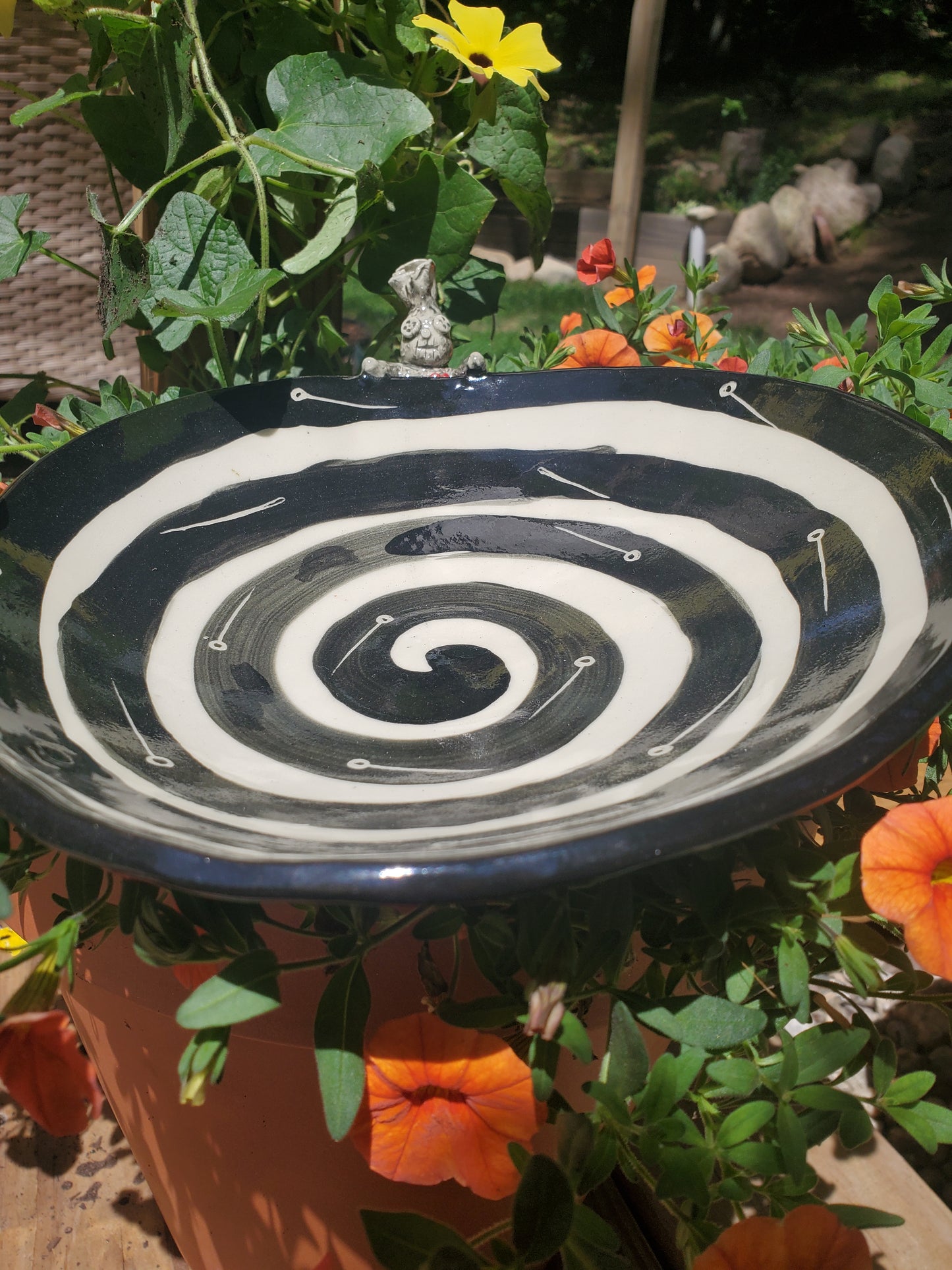 Black and white bowl with Voodoo Doll
