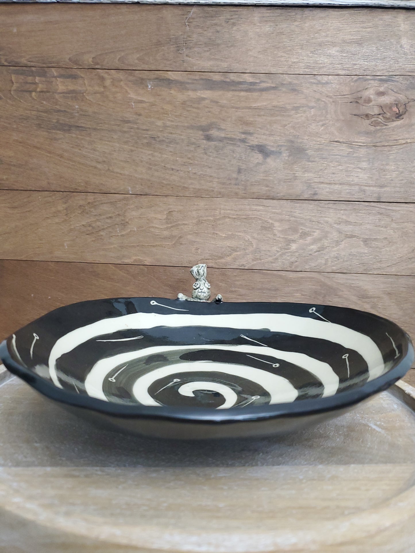 Black and white bowl with Voodoo Doll