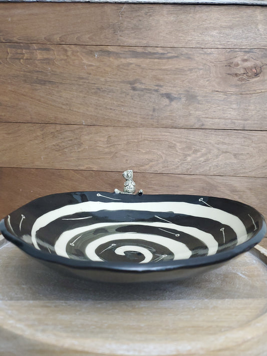 Black and white bowl with Voodoo Doll
