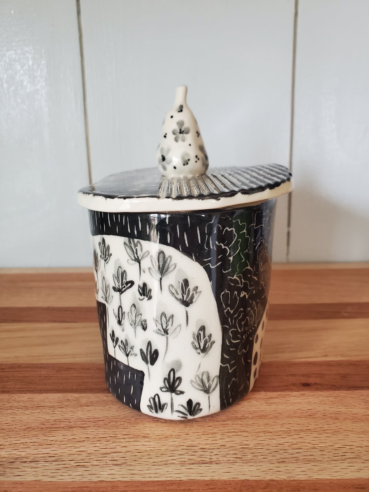 Ceramic jar / vase with warped lid