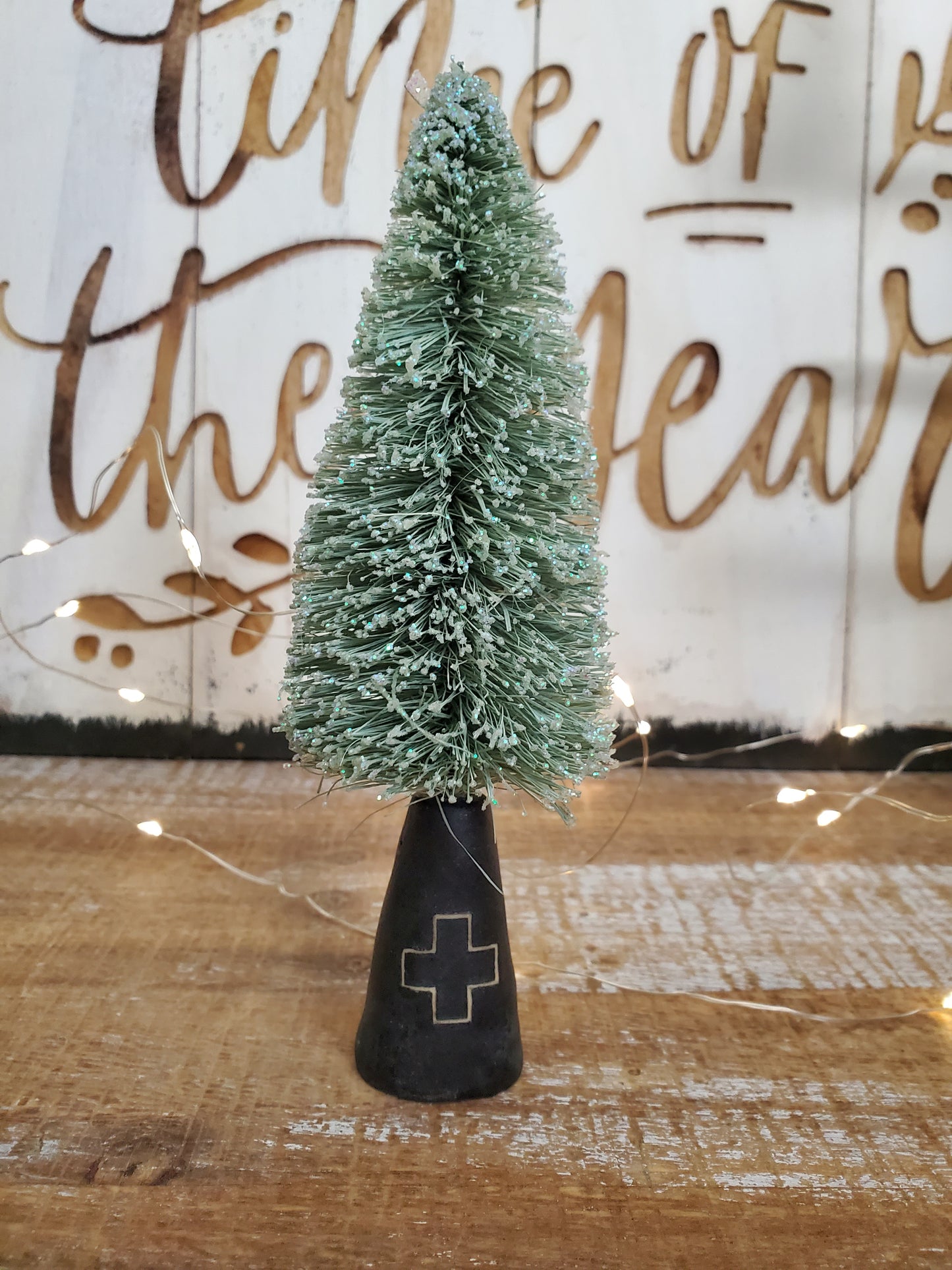 Bottle brush tree and ceramic swiss cross stand
