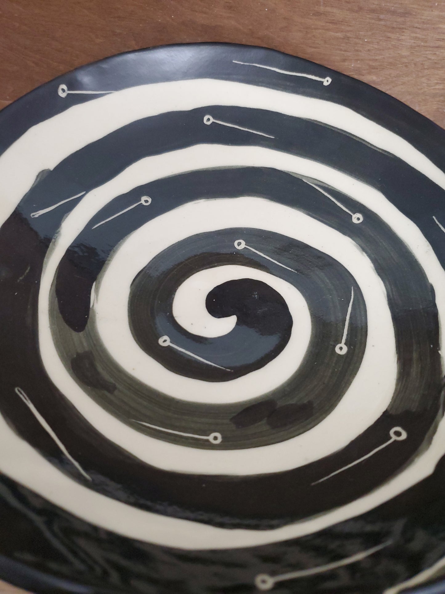 Black and white bowl with Voodoo Doll