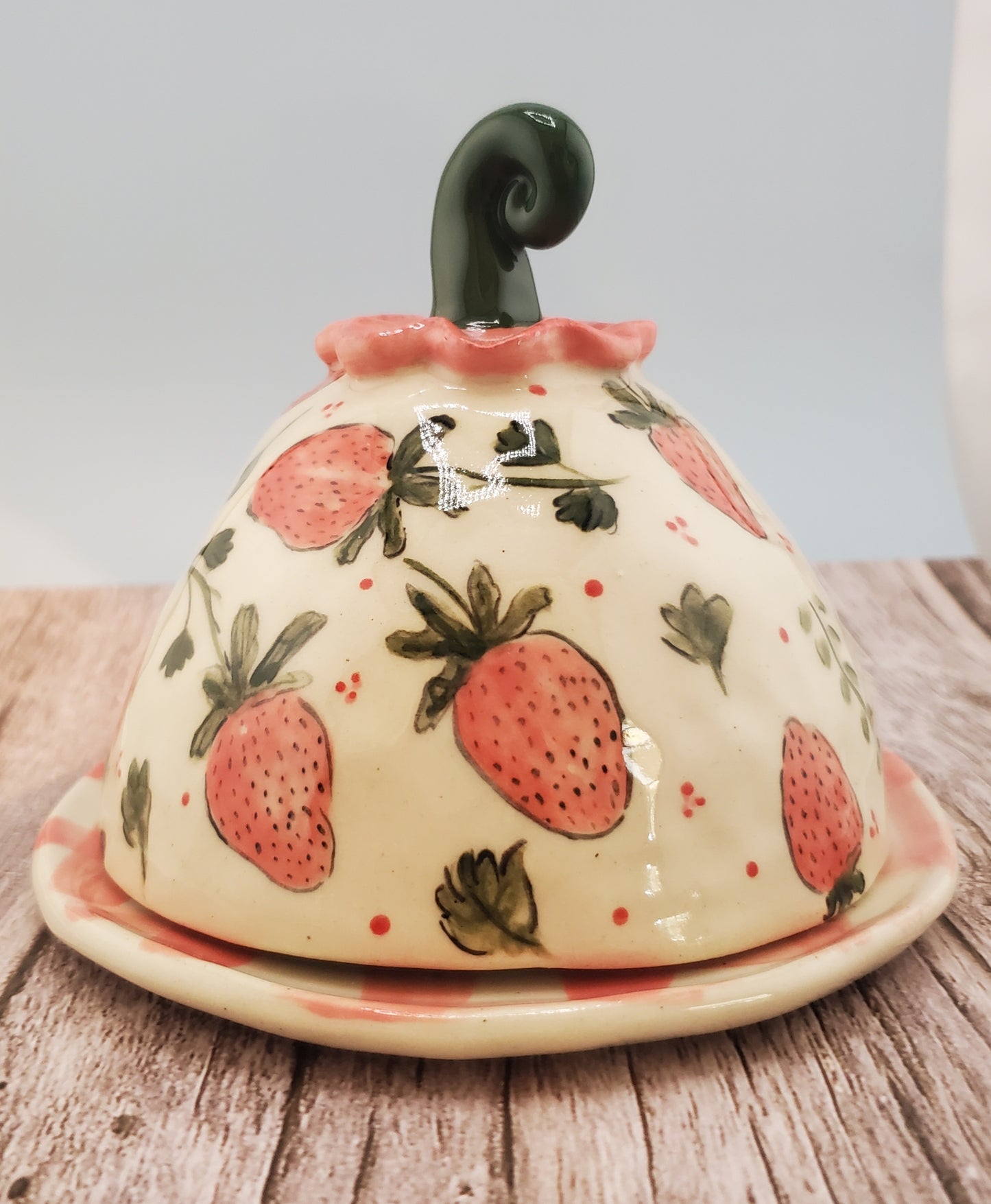 Strawberry cheese dome with gingham plate