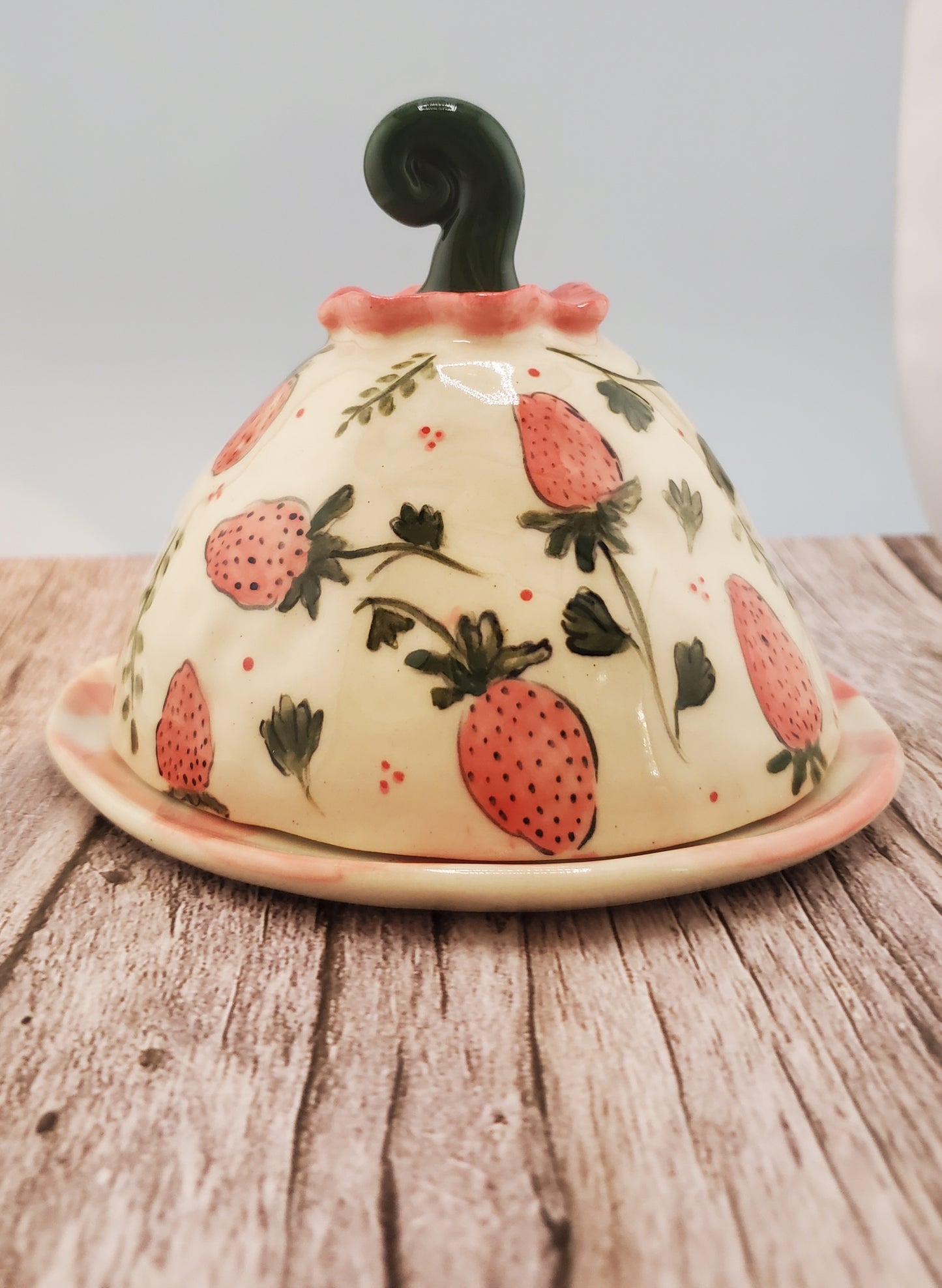 Strawberry cheese dome with gingham plate