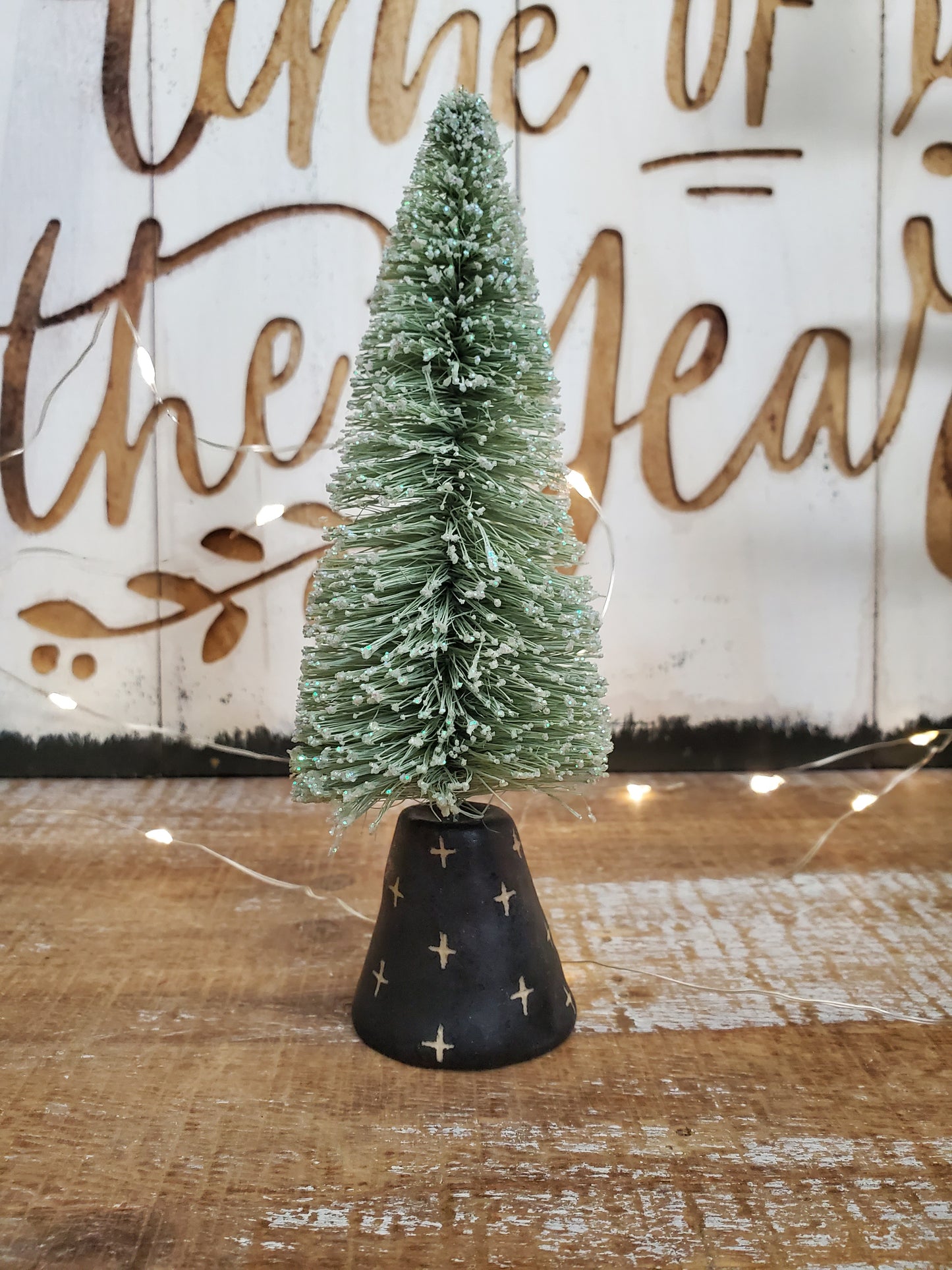 Bottle brush tree and ceramic swiss cross stand